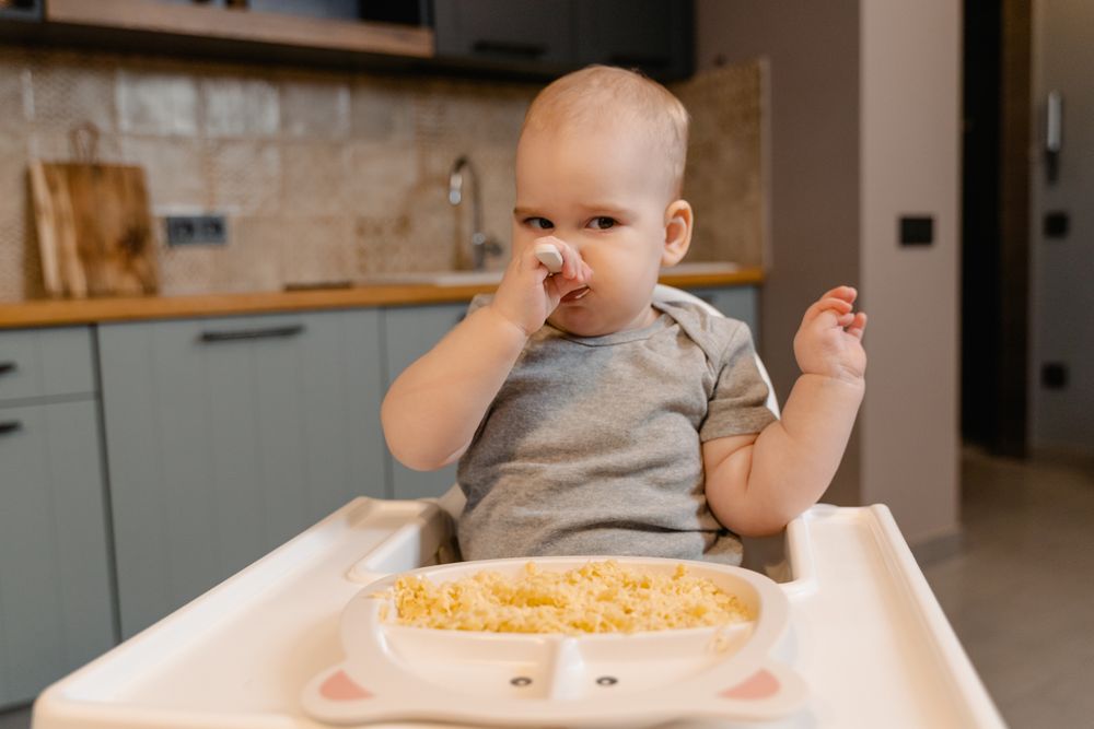 Toddler eating from a bowl